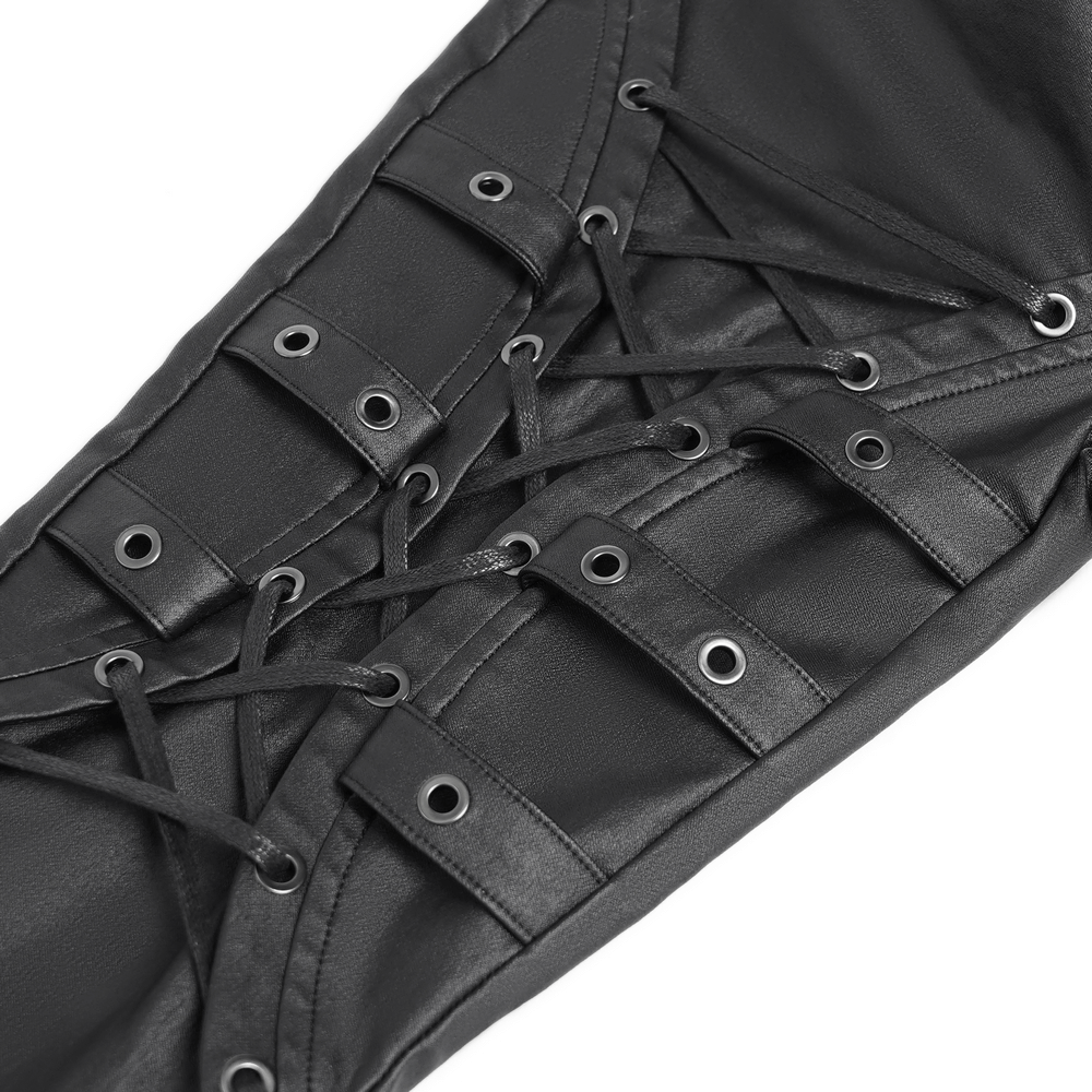 Close-up of gothic black faux leather pants with lace-up straps and metal eyelets, showcasing punk rock style.