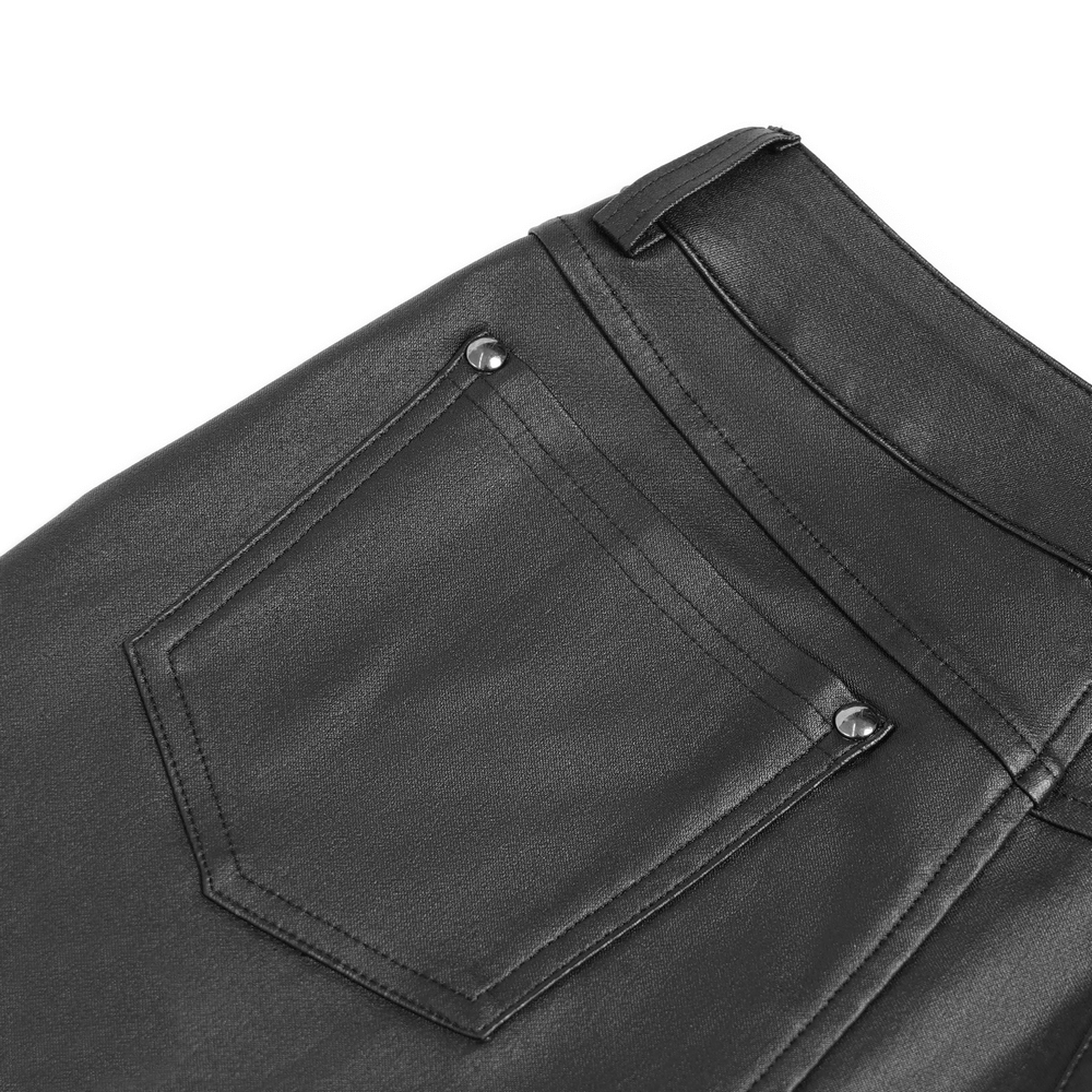 Close-up of gothic black faux leather pants with functional back pocket and metal detailing.