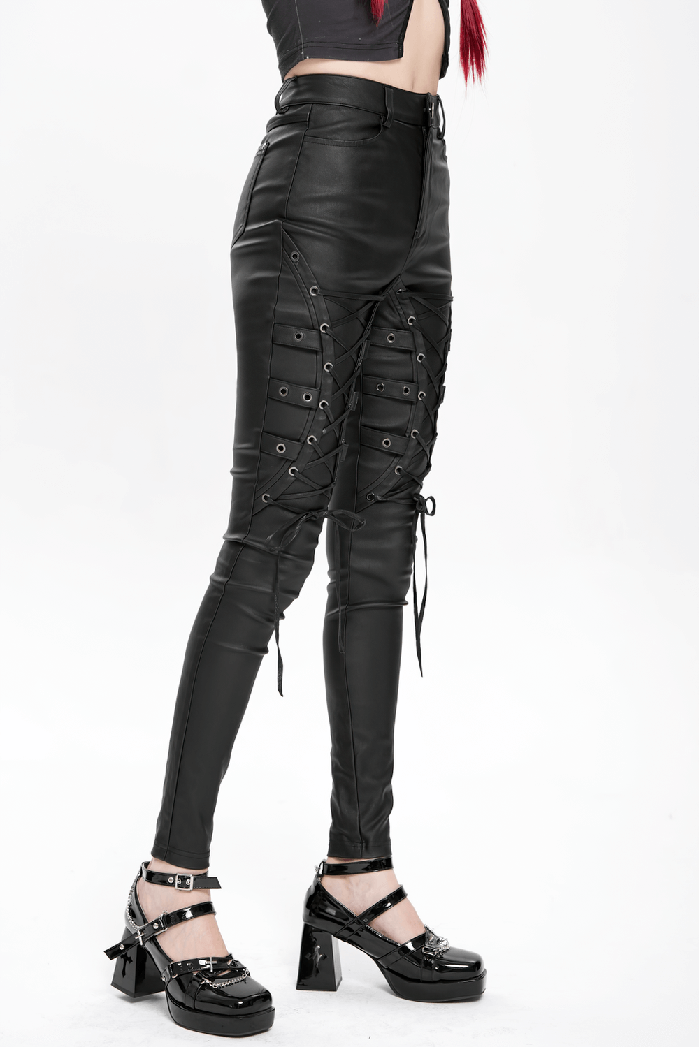 Gothic black faux leather pants with crisscross lace-up straps, perfect for punk rock fashion and nightlife.