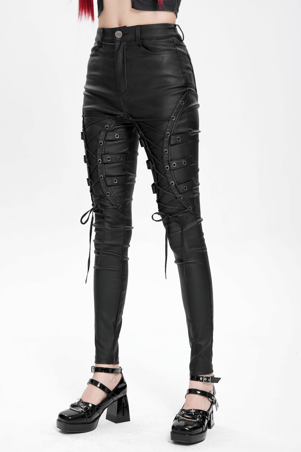 Gothic black faux leather pants with lace-up straps and metal eyelets, perfect for edgy punk rock style.