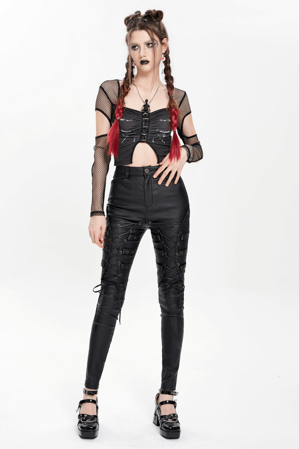 Gothic black faux leather pants with lace-up straps and punk rock style for women, perfect for nightlife or concerts.
