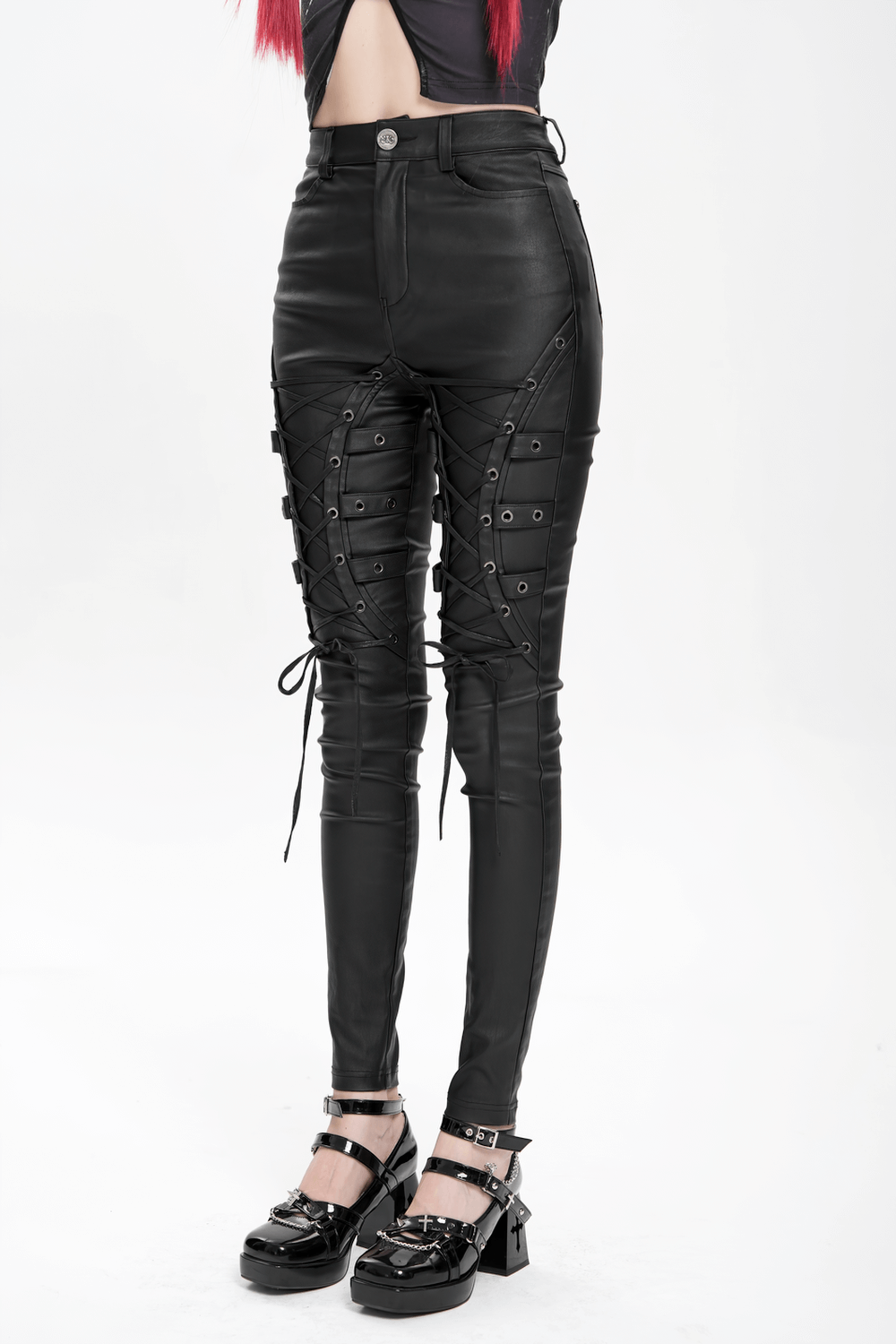 Gothic black faux leather pants with lace-up straps and metal eyelets, perfect for punk rock style.