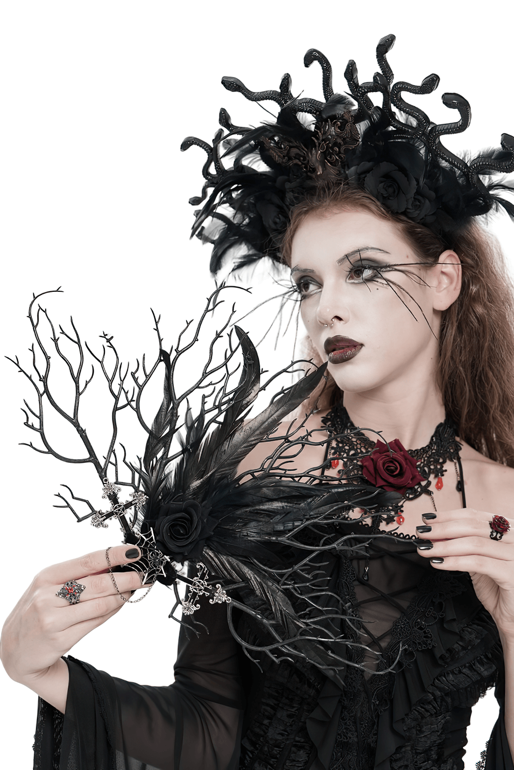 Gothic Black Feather and Twig Hand Fan with Cross Charms held by a woman in a dark gothic outfit.