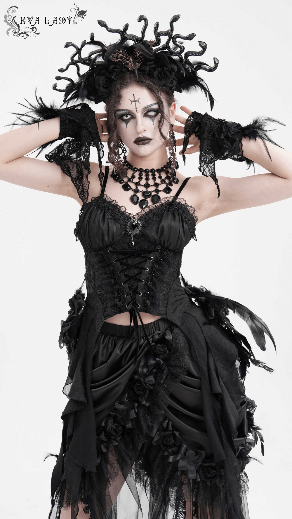 Gothic woman in black feather corset top with lace-up, floral details, and dramatic accessories, exuding dark elegance.