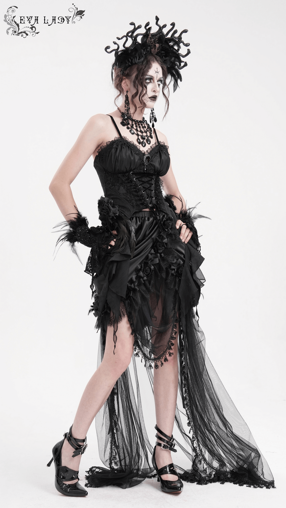 Gothic black feather corset top with lace-up and floral details, featuring dramatic sheer lace skirt, perfect for dark elegance.