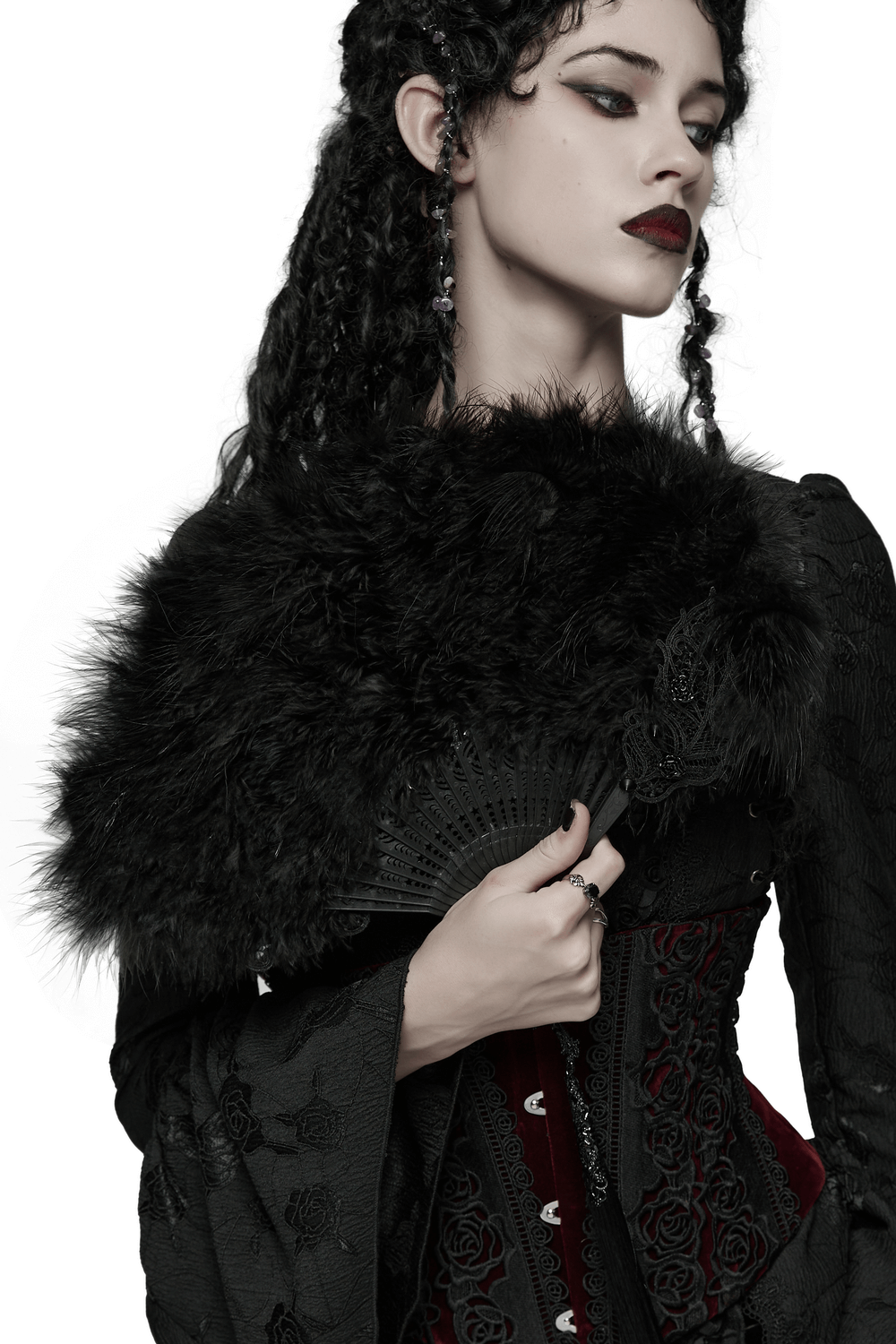 Elegant Gothic Black Feather Fan with Tassel and Cross Pendant held by a model in dark attire, emphasizing gothic charm.