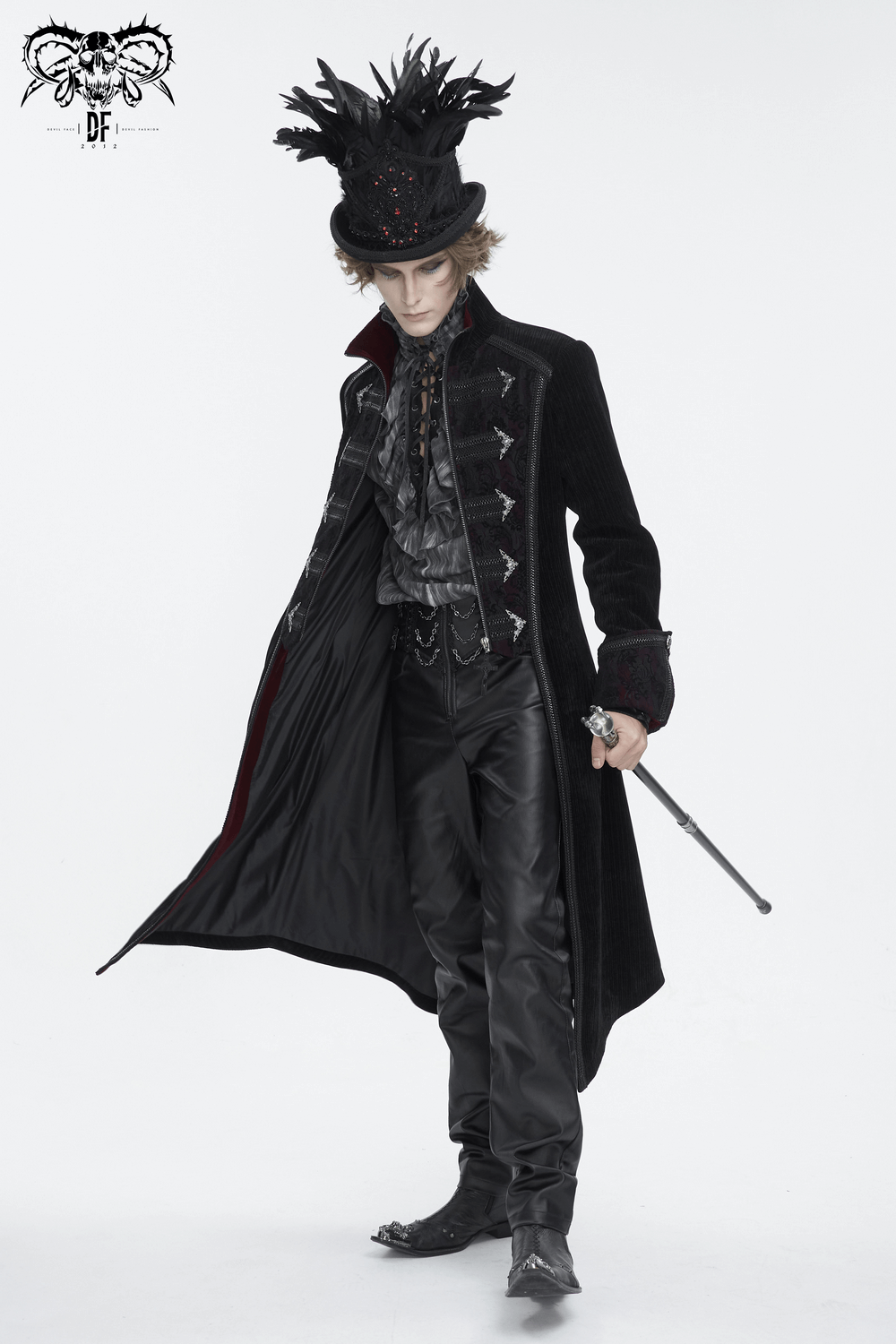 Elegant male model in a Gothic black feathered top hat with embroidered accents and a long coat.