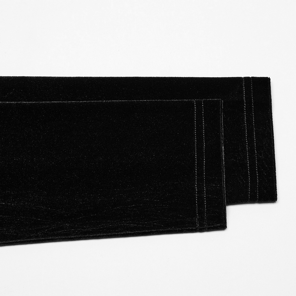 Close-up of luxurious black velvet fabric, perfect for a gothic dress design featuring a sleek and sophisticated texture.