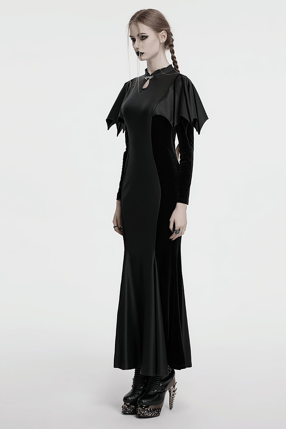 Elegant gothic black fishtail dress with bat shoulders, keyhole collar, and striking silhouette.