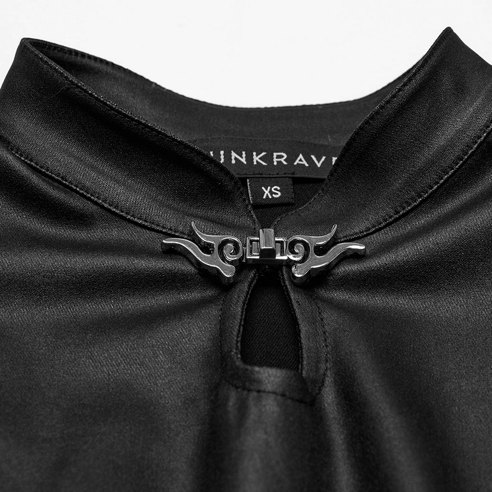 Close-up of a keyhole collar with metal buckle detail on a black gothic dress.