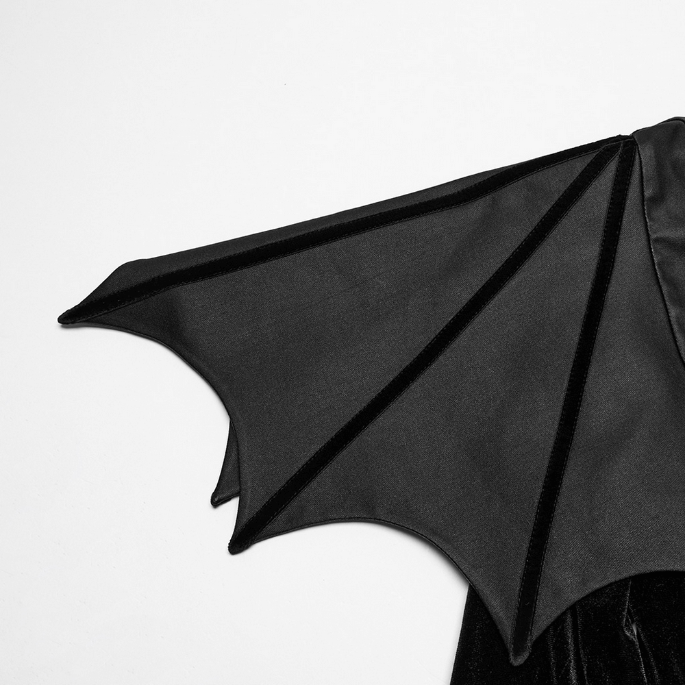 Close-up of batwing shoulder design on black gothic dress, showcasing elegant fabric and unique style.