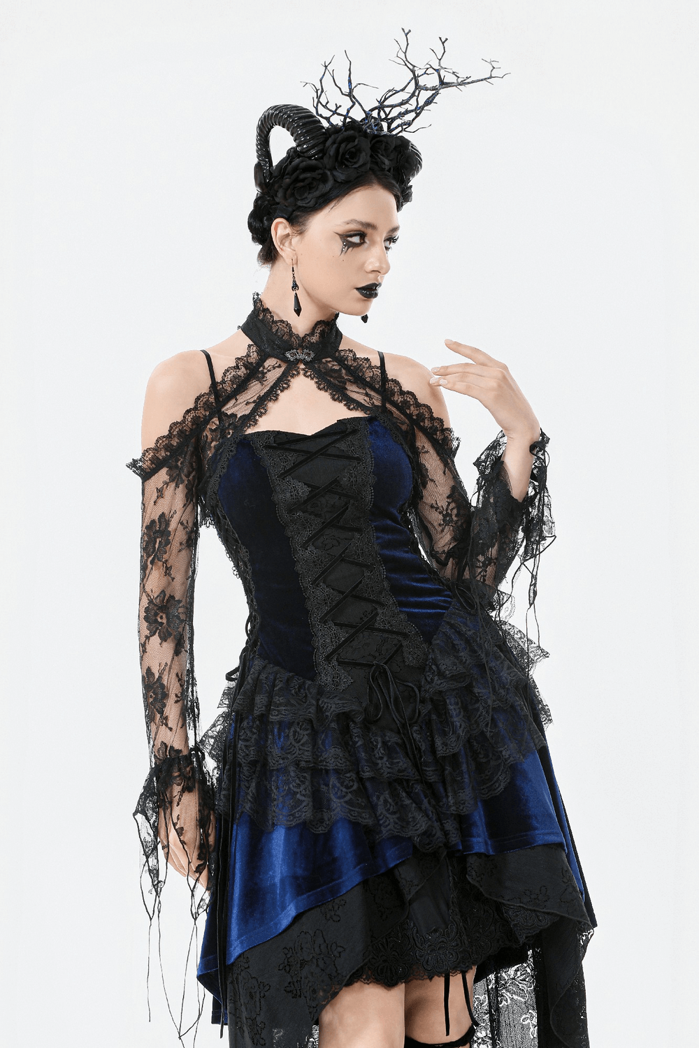 Gothic model wearing a black floral lace shrug and dark dress, showcasing Victorian elegance and alternative style.