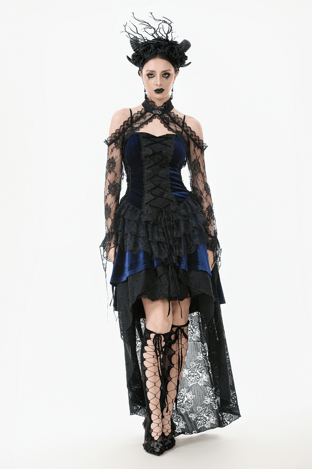 Gothic model in blue dress with black floral lace shrug and high-low hem, showcasing dark Victorian style.
