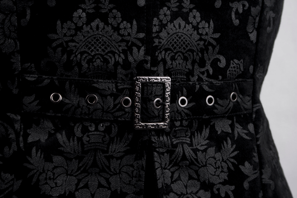 Close-up of a gothic black floral vest featuring intricate detailing and stylish buckle.