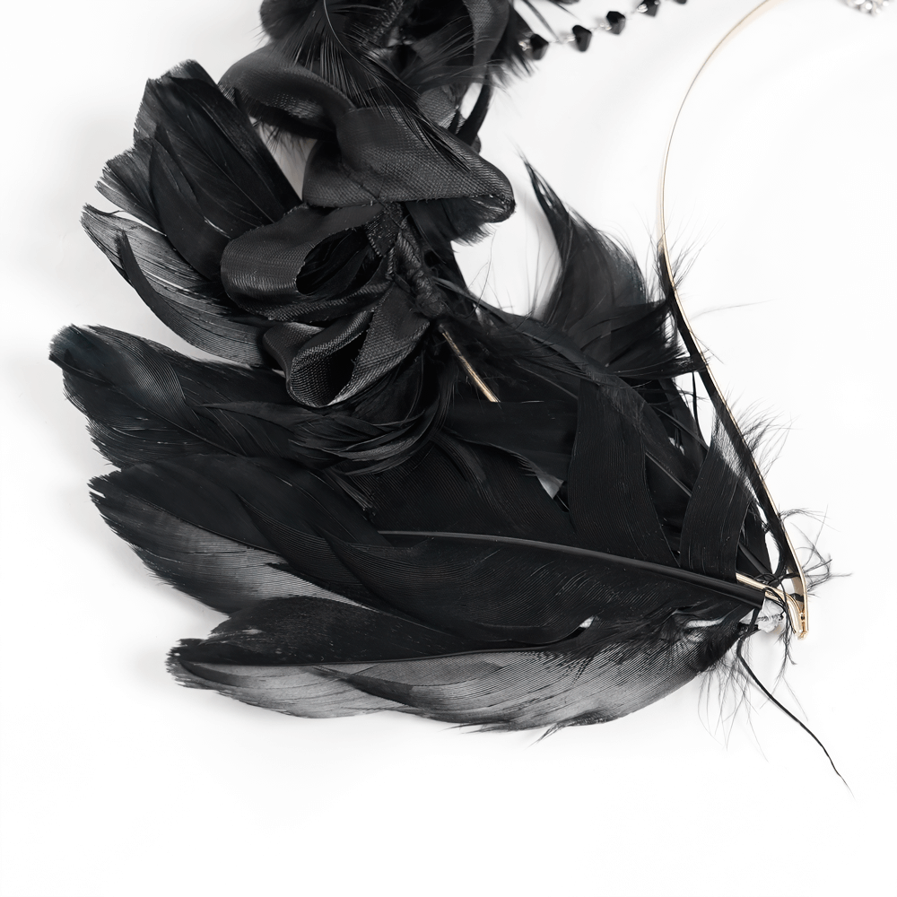 Close-up of black feathers and satin ribbons on a gothic halo crown, perfect for alternative fashion and festivals.