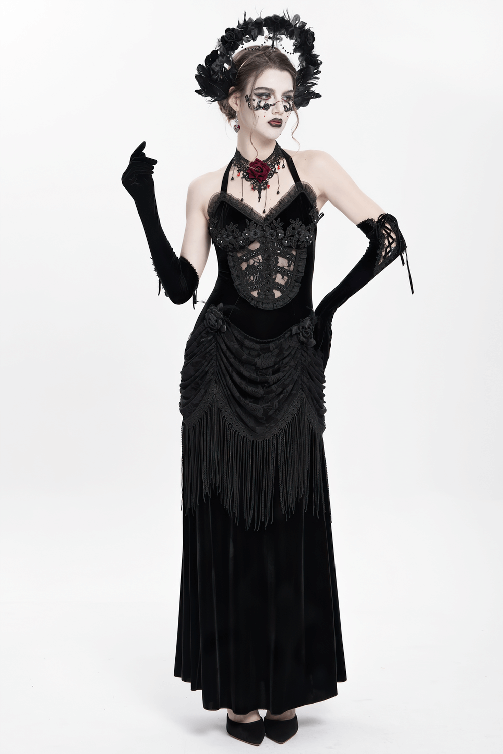 Gothic model in black dress with feather halo crown, showcasing dark fantasy style and baroque elegance.