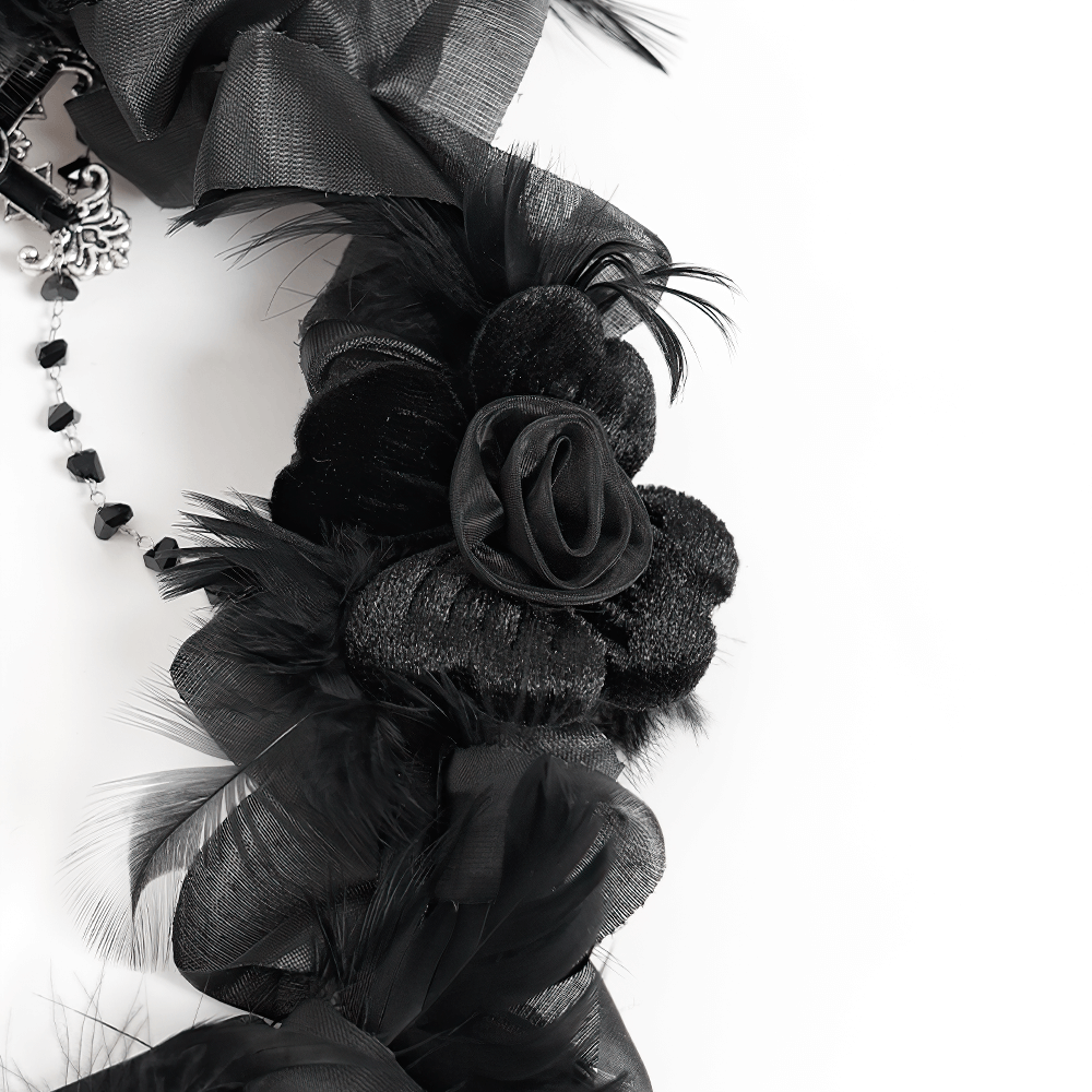 Close-up of a gothic black halo crown with rose and feather details, perfect for dark fantasy looks.