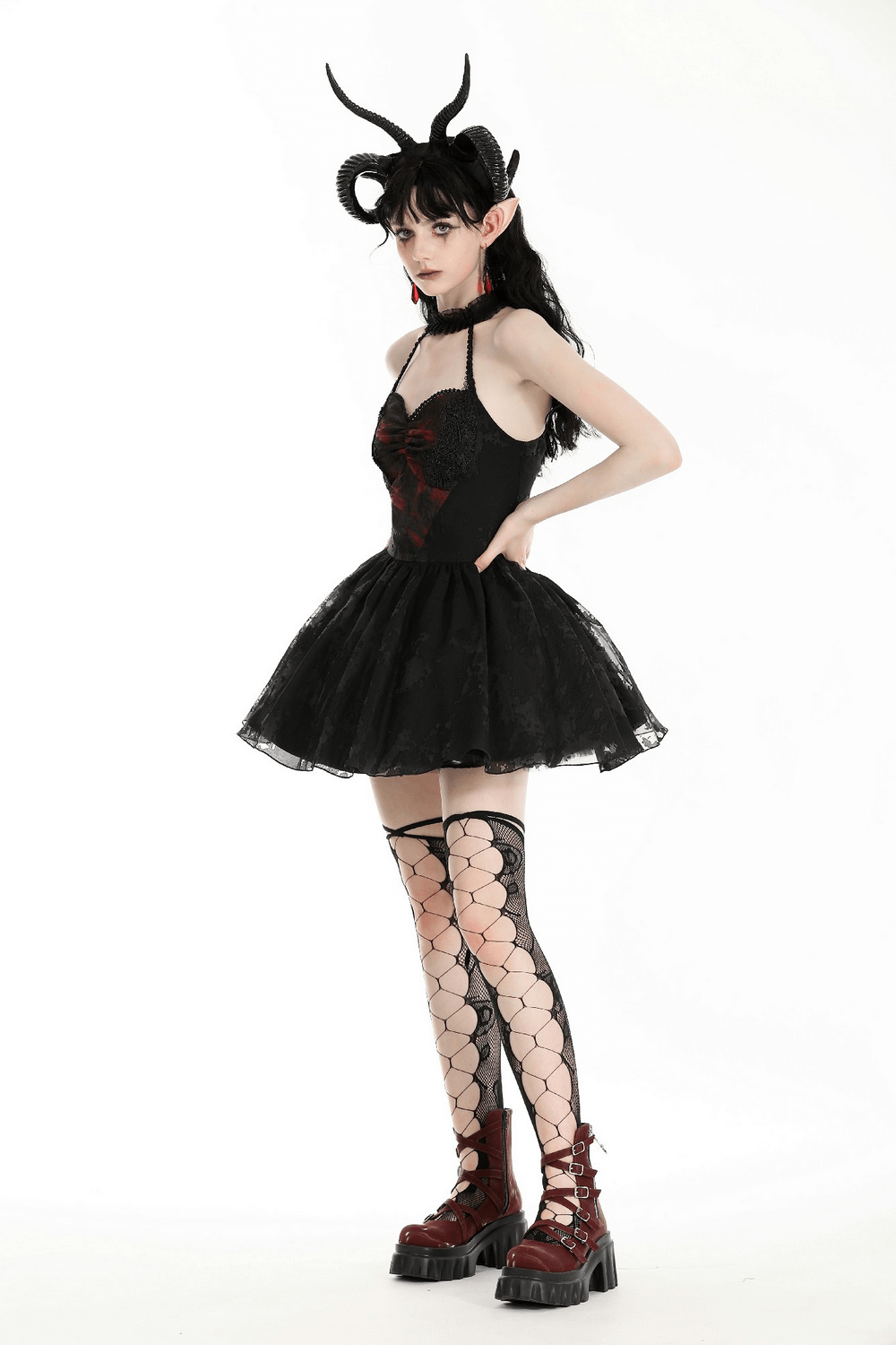 Gothic black halter dress with lace and ruffle details, showcasing dark vintage style and elegant silhouette.