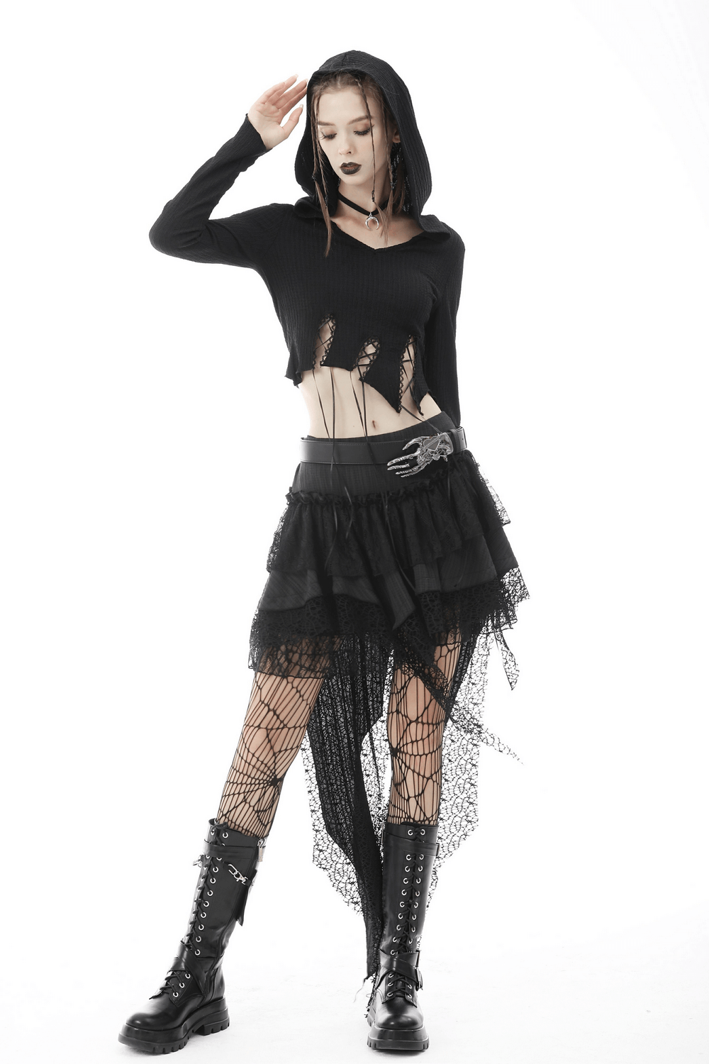 Gothic black hooded crop top with lace detailing, edgy style, paired with a layered black skirt and fishnet stockings.