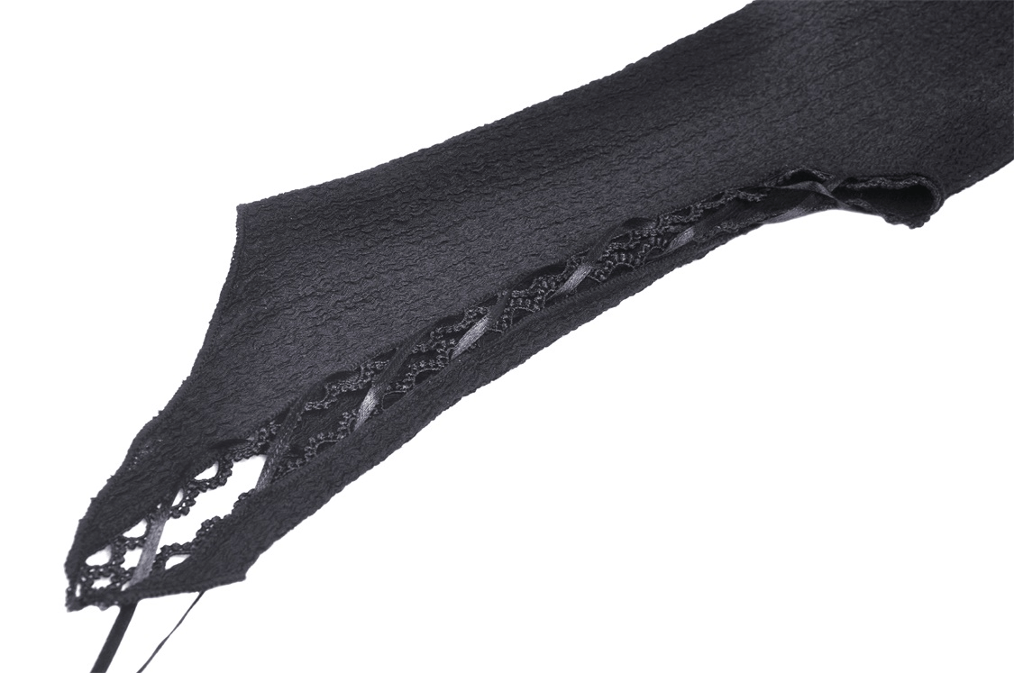 Close-up of black lace detailing on a gothic hooded crop top, showcasing intricate design elements.