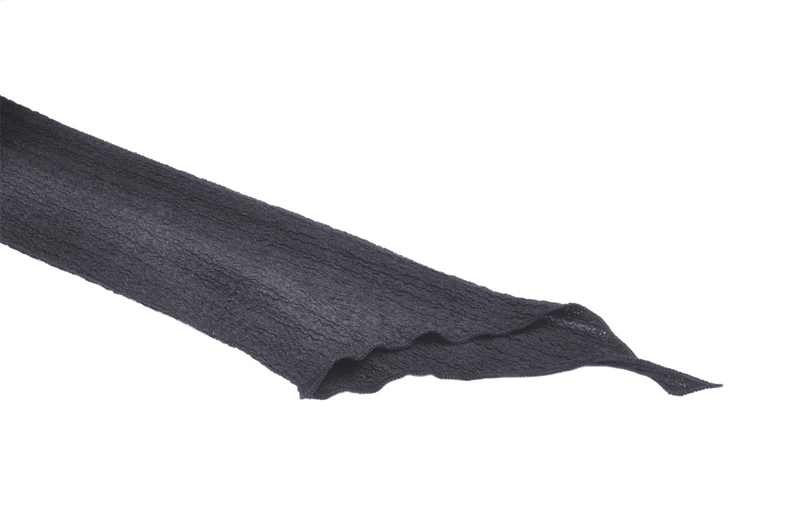 Close-up of textured black fabric strip, perfect for gothic fashion or edgy designs.