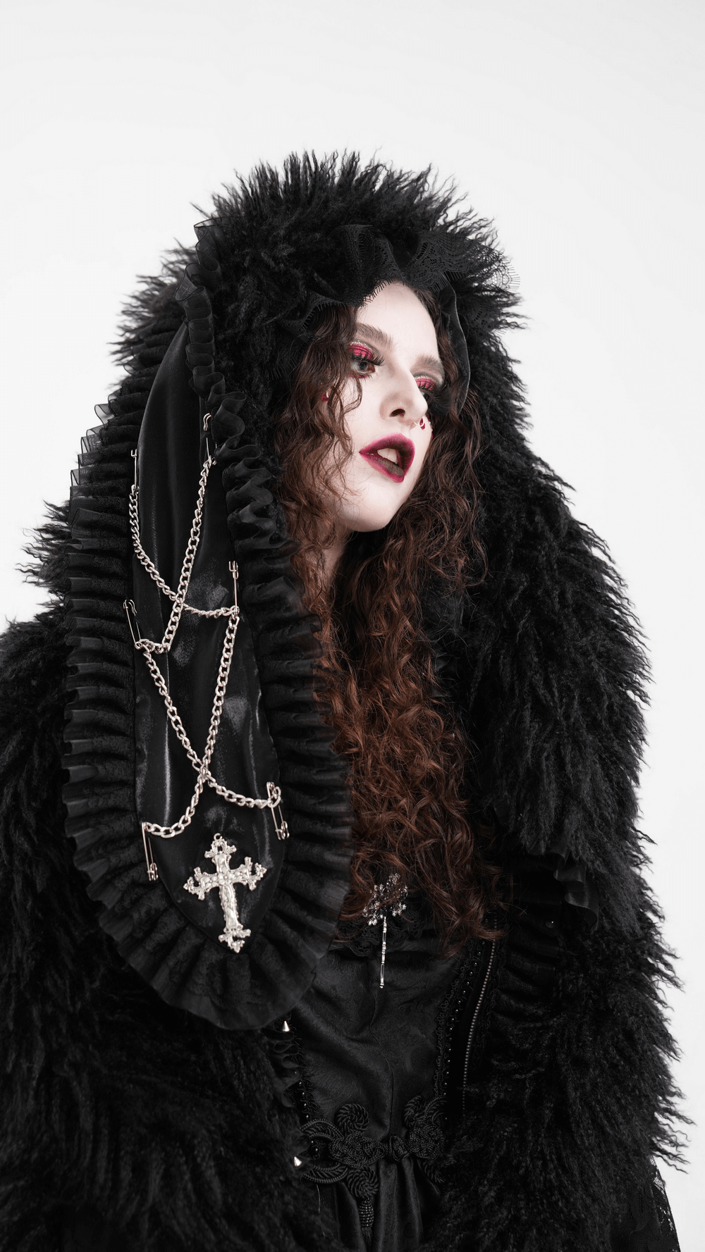 Gothic black hooded jacket with lace and faux fur, featuring a dramatic oversized hood and chain embellishments.