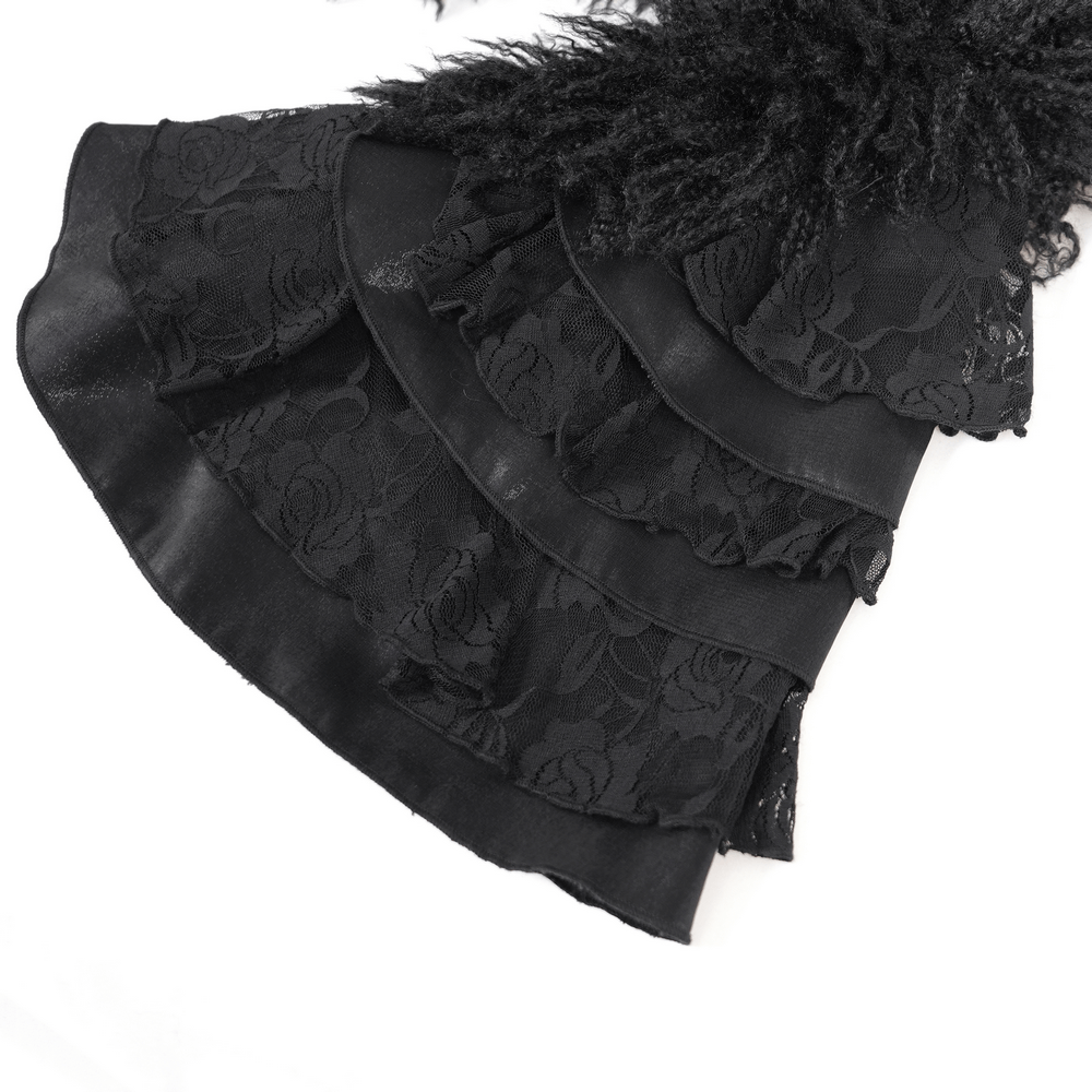 close-up of layered ruffled sleeves with lace and faux fur details from a gothic black hooded jacket for women