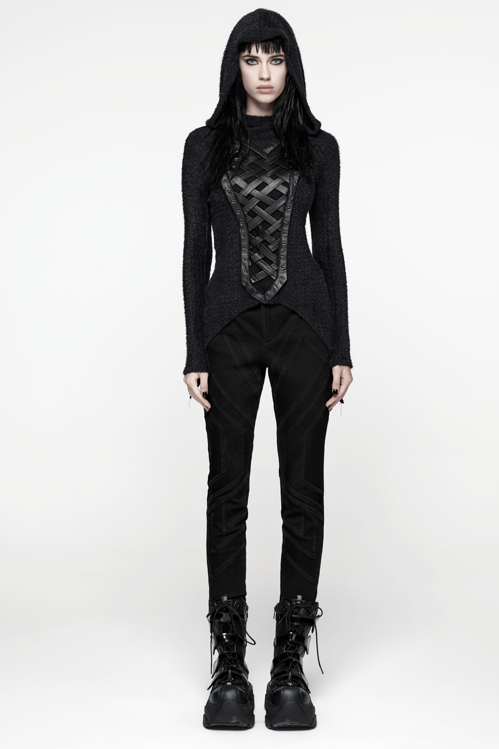 Gothic Black Hooded Top with Woven Cross Front Detail worn with black pants and chunky boots, showcasing punk style.