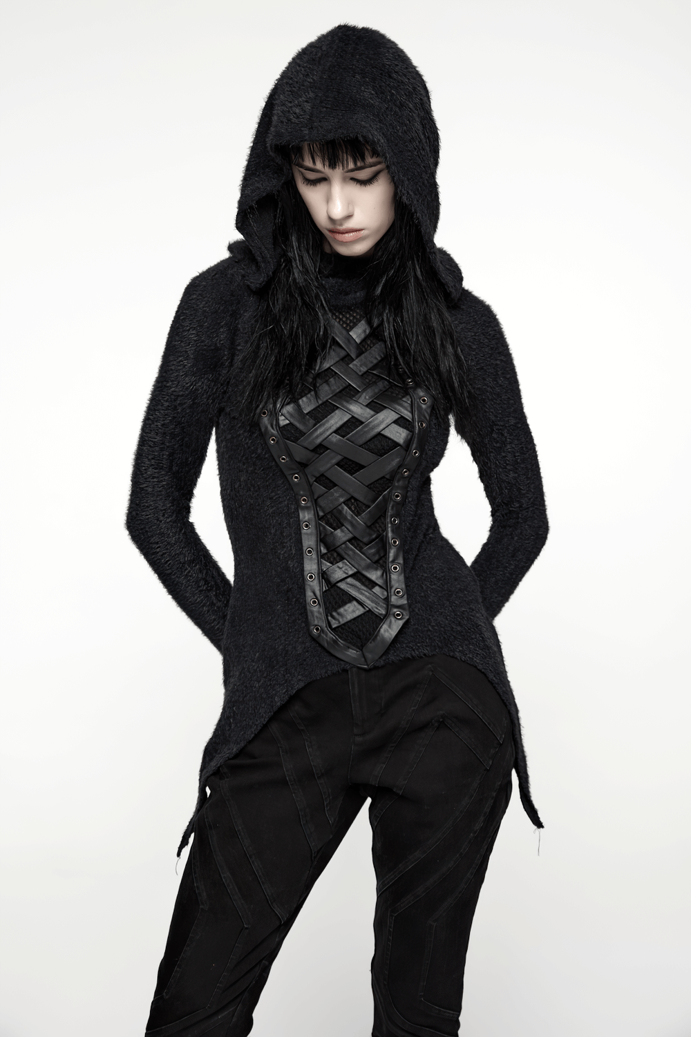Gothic Black Hooded Top with Woven Cross Front Detail worn by model, showcasing alternative style and asymmetrical hem design.