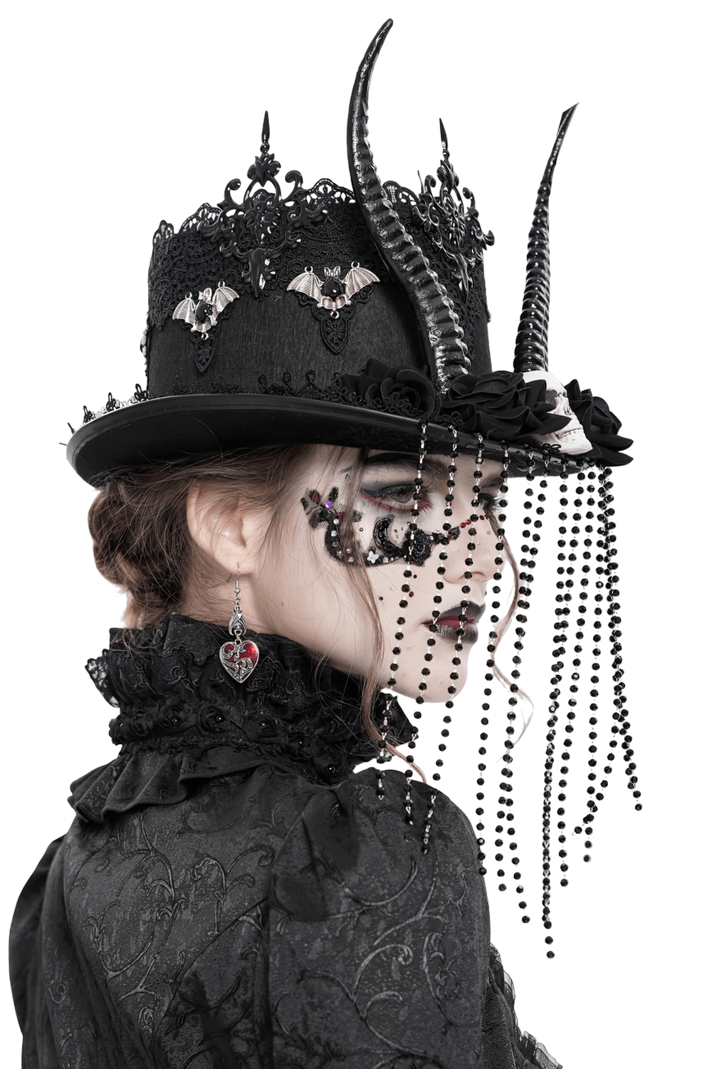 Gothic black horned top hat adorned with skulls, roses, and bead chains, perfect for dark fashion and stagewear.
