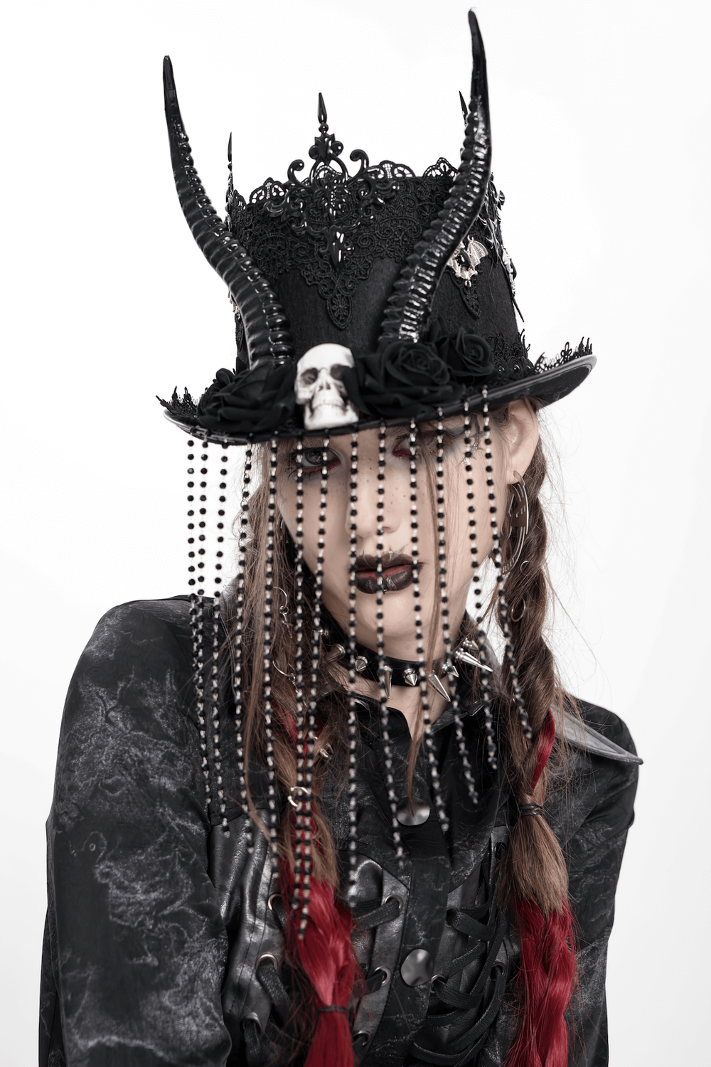Gothic black horned top hat with skull, lace, and bead chains for dark fashion enthusiasts.