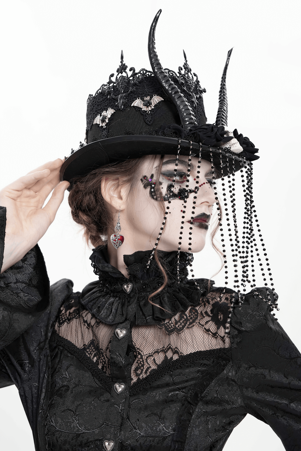 Gothic black horned top hat with skull, lace, and bead details, perfect for alternative fashion.