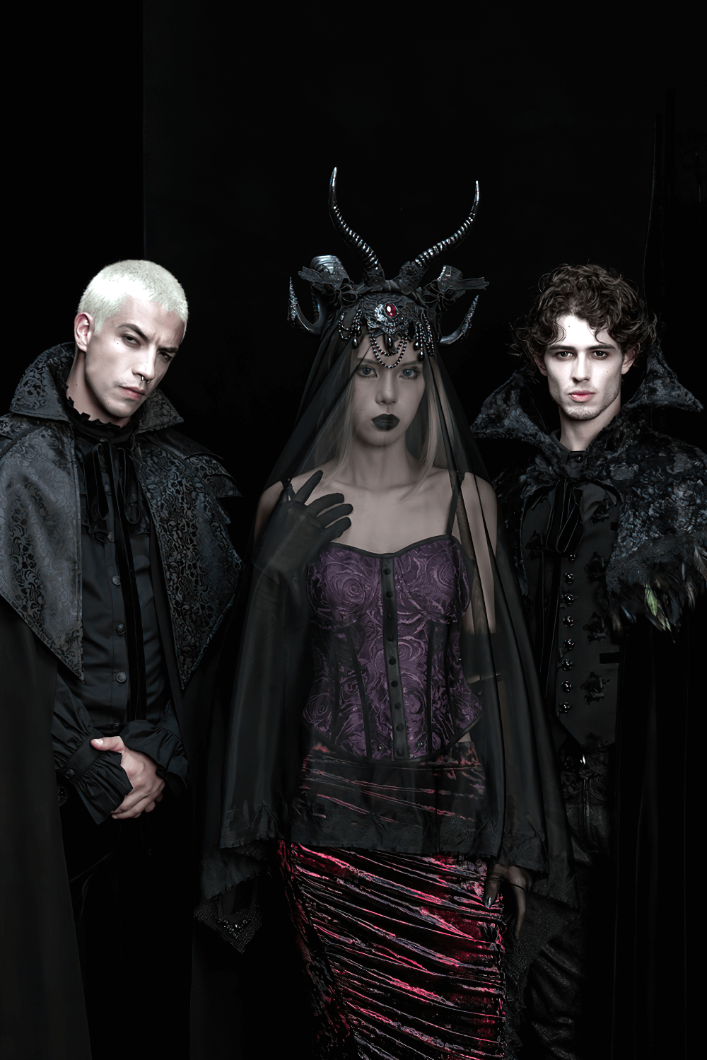 Gothic Black Horned Veil with Lace and Gemstone Chains worn by model with dark attire and two companions in gothic fashion.