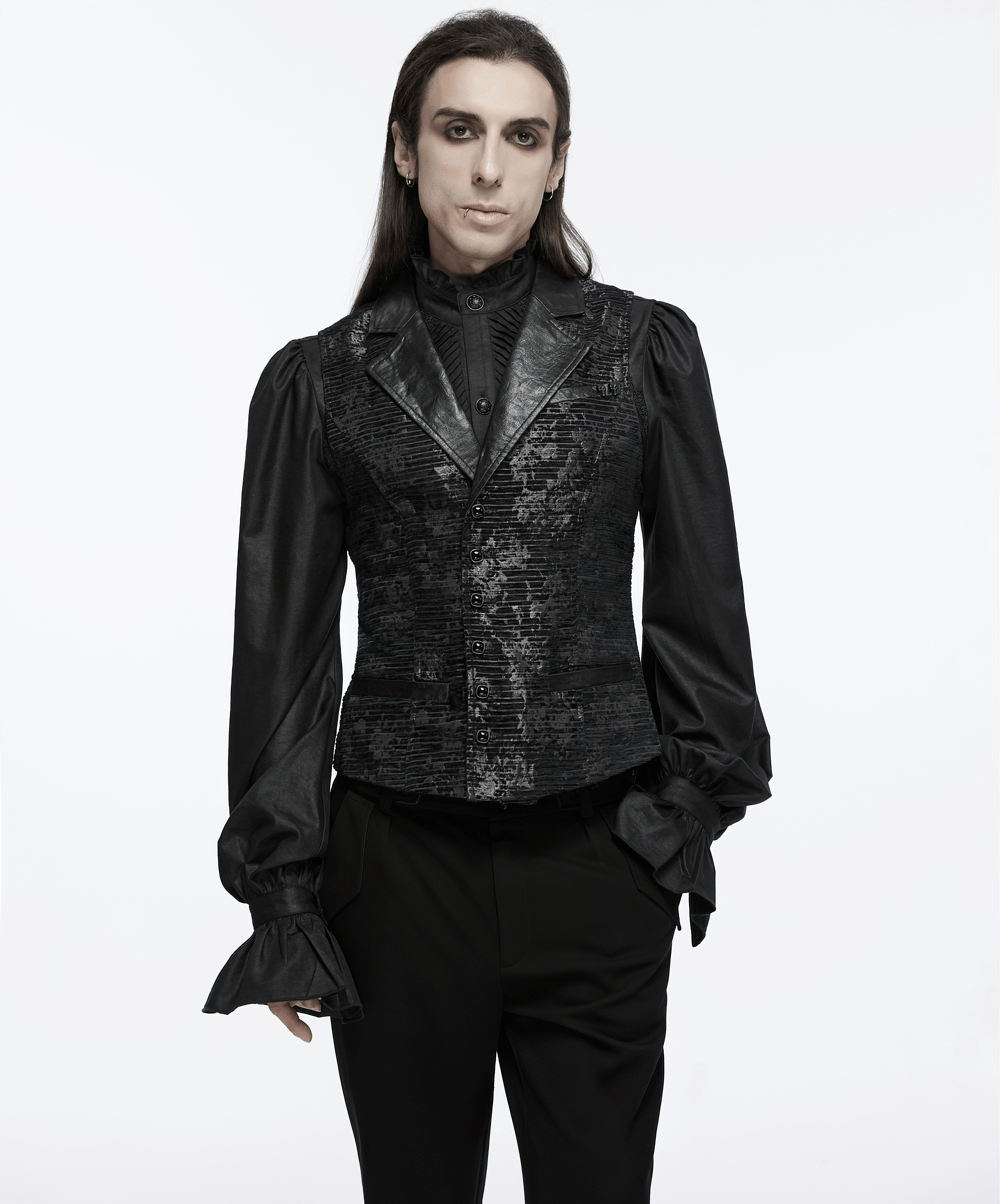 Gothic black jacquard waistcoat with elegant skull details and 3D gemstone buckle, styled with dramatic sleeves.