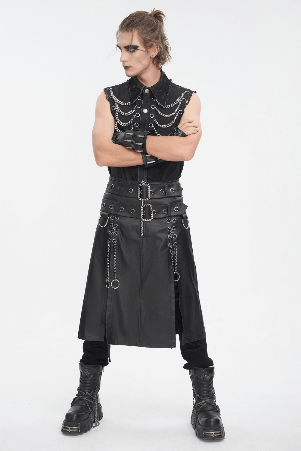 Edgy punk model showcasing a gothic black kilt with chains and metal details, perfect for alternative fashion.