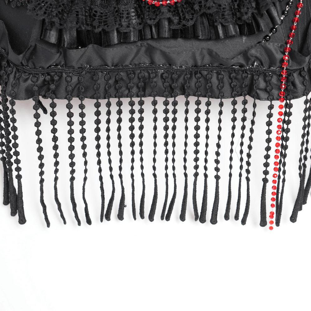 Close-up of black lace and bead fringe with red accents from a gothic umbrella.