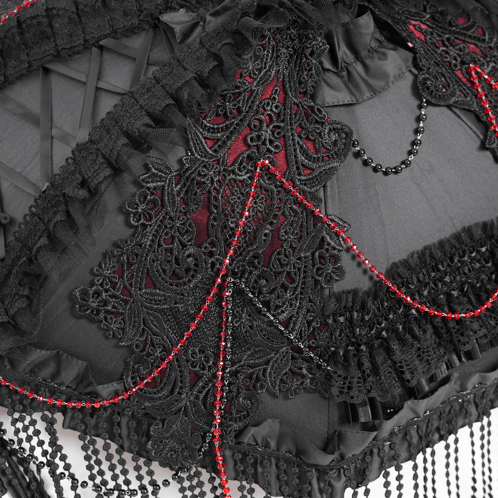 Close-up of gothic black lace umbrella featuring red bead fringe and intricate detailing.