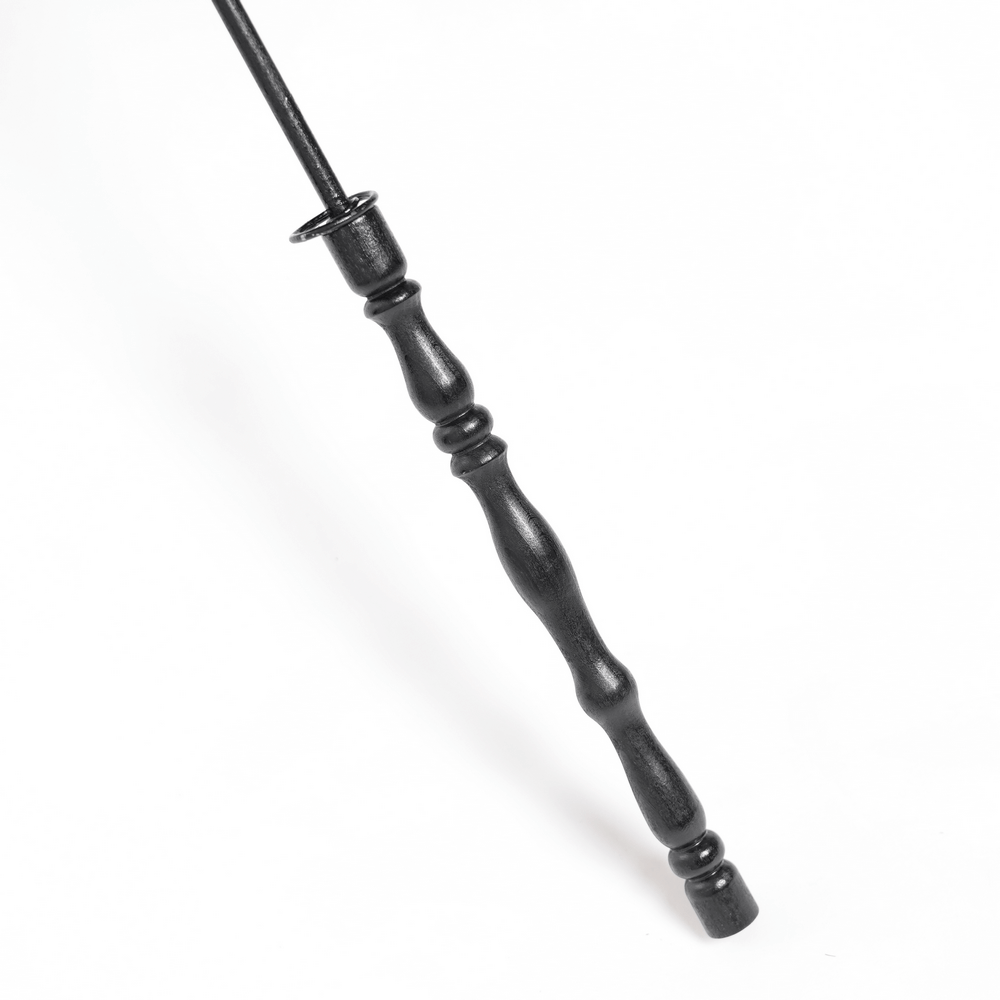 Elegant black umbrella handle with vintage design, perfect for gothic fashion accessories.