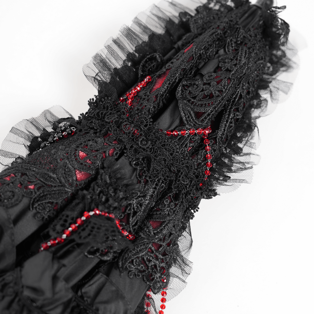 Gothic black lace umbrella with red bead accents and lace fringe for a vintage-inspired look.
