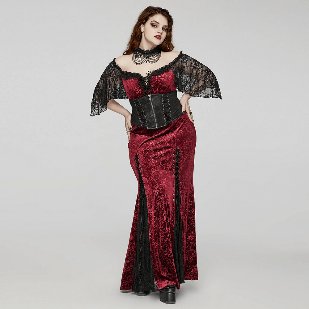 Gothic women in a dramatic red and black velvet gown paired with lace and a chain choker, showcasing bold style.