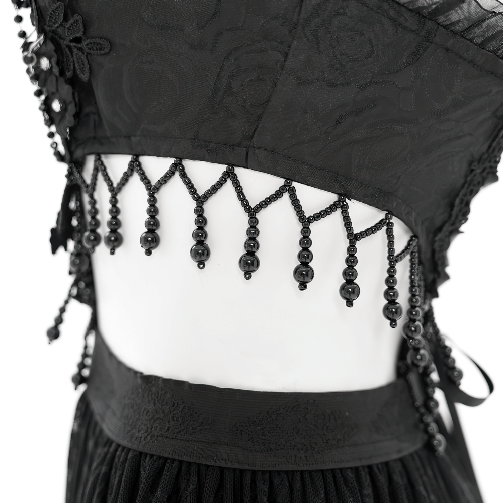 Close-up of Gothic corset dress back with intricate lace and bead detailing, showcasing elegance and dark glamour.