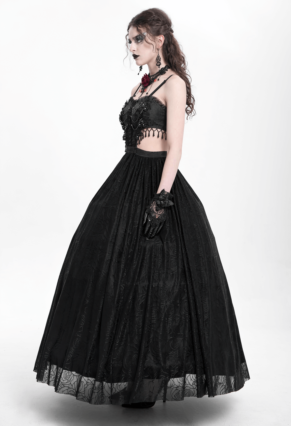 Gothic black lace corset dress with flowing skirt and rose details, embodying dark elegance and sophistication.
