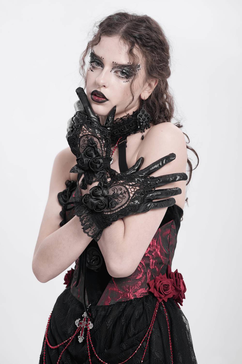 Gothic black lace and satin rose gloves adorned with ruffles, perfect for alternative fashion.
