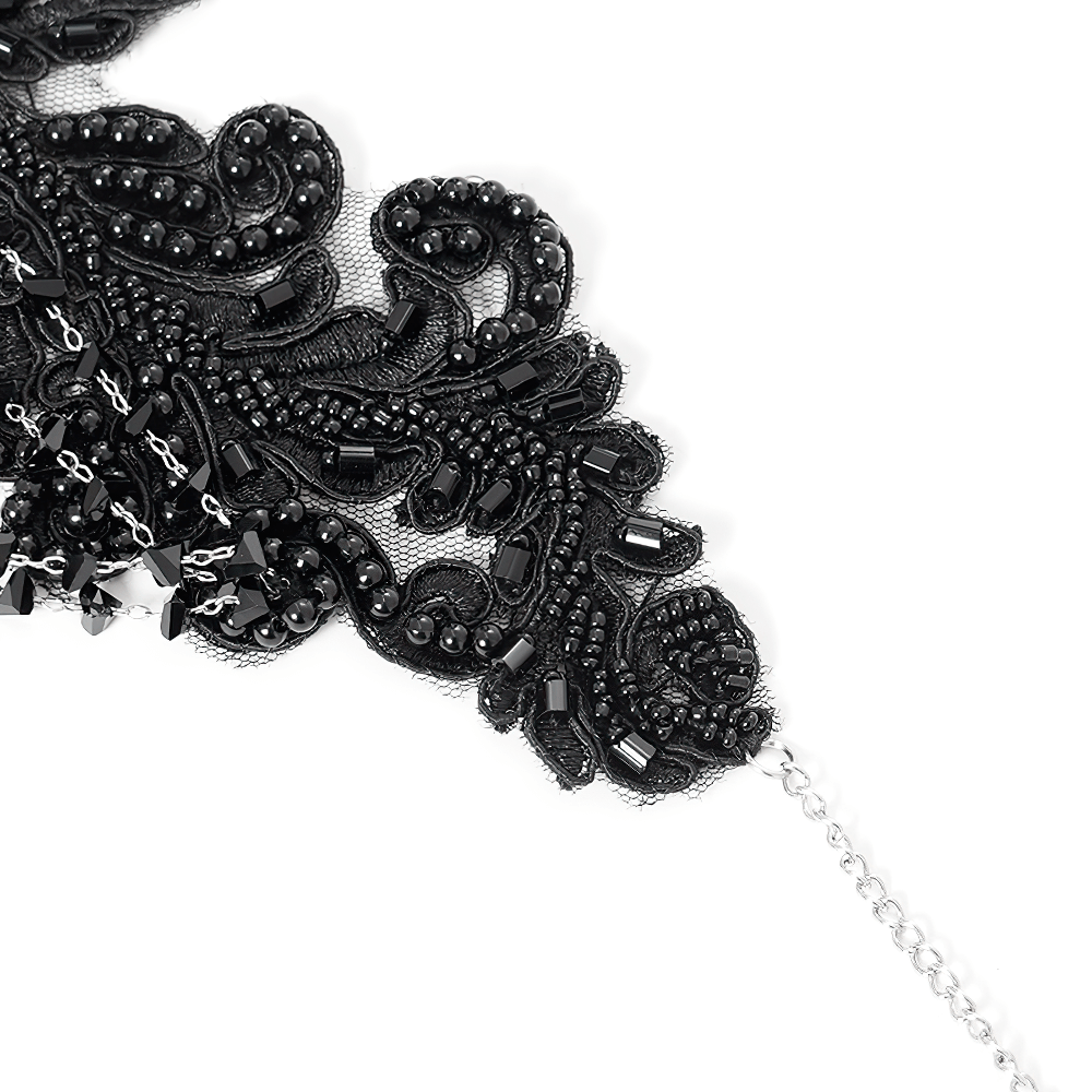 Gothic black lace choker necklace with intricate bead design and silver chain detail.