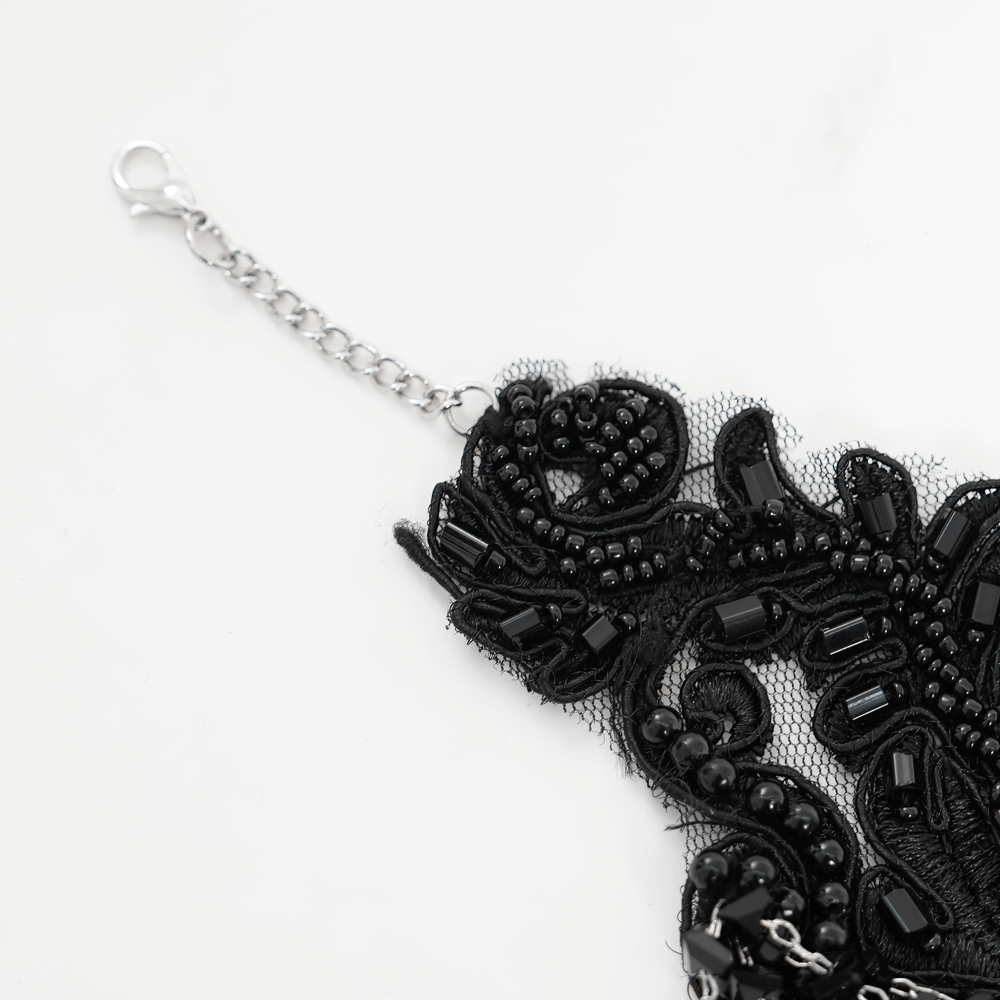 Intricate black lace choker necklace with beaded chains and adjustable clasp, perfect for gothic fashion.