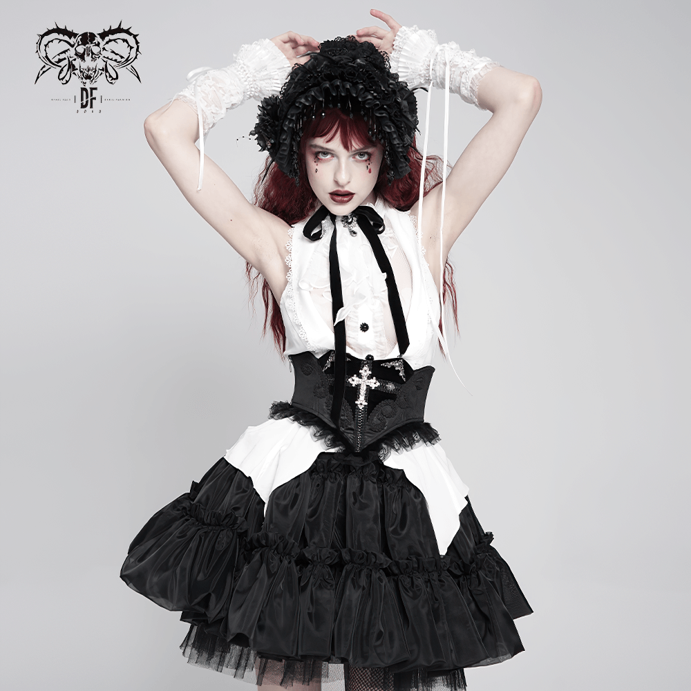 Gothic model in elegant black and white dress with cross corset, showcasing Victorian-inspired fashion.