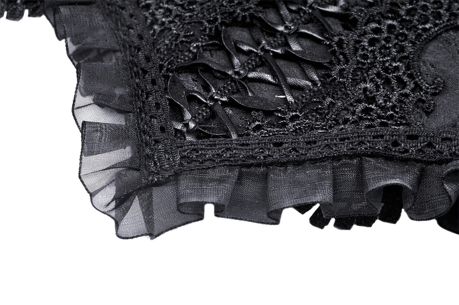 Close-up of Gothic black lace corset belt with ruffled mesh trim and satin ribbon lacing for dramatic waist definition.