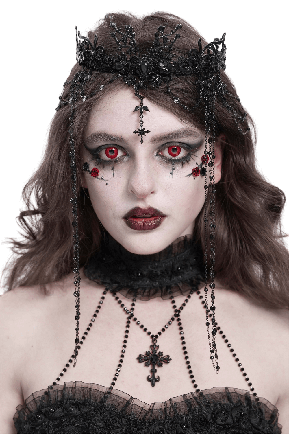 Gothic black lace crown and beaded chains with cross details worn by a model with striking red eyes.