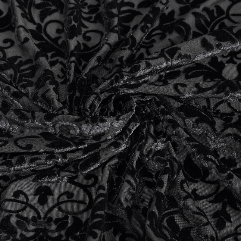 Close-up of luxurious black lace fabric with gothic floral pattern, perfect for elegant dresses.
