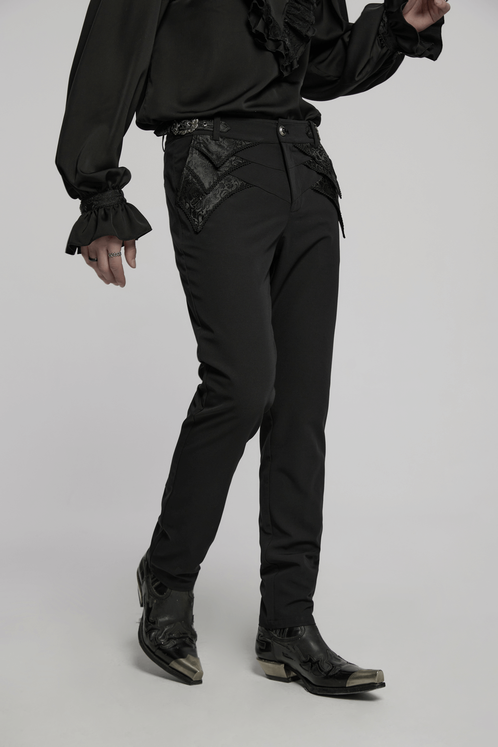 Gothic black trousers with lace detail and adjustable waist, styled with a chic black blouse and boots.